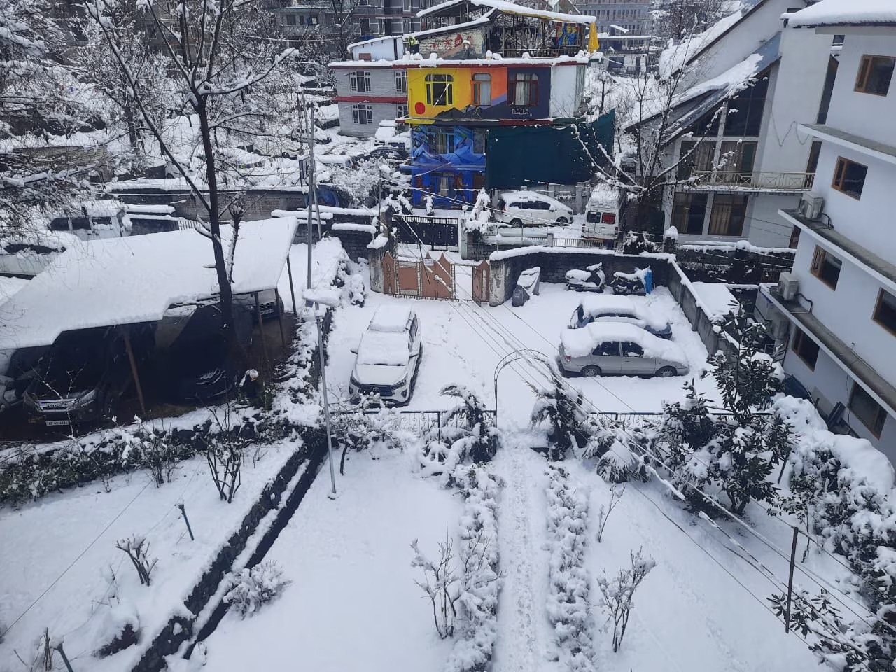 Everest Villa Manali exterior in snow